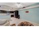 Bright living room features a ceiling fan, complementing the open flow to the modern kitchen at 6916 Dorita Ave # 101, Las Vegas, NV 89108