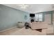 Spacious living room with a fireplace, complemented by views through the large window and open layout at 6916 Dorita Ave # 101, Las Vegas, NV 89108