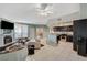 Inviting living room with a fireplace and modern kitchen, perfect for relaxing and easy meal preparation at 6916 Dorita Ave # 101, Las Vegas, NV 89108