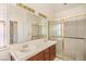 Bathroom featuring double vanity, updated tile and large mirror at 7140 Pascal Dr, Las Vegas, NV 89156