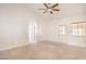 Light-filled bedroom with neutral walls, ceiling fan and ensuite access at 7140 Pascal Dr, Las Vegas, NV 89156