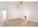 Spacious bedroom with neutral carpet, ensuite bath and ceiling fan at 7140 Pascal Dr, Las Vegas, NV 89156