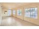 Large bonus room featuring tile floors, natural light and access to exterior at 7140 Pascal Dr, Las Vegas, NV 89156