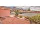 Front yard featuring low-water landscaping with decorative rock, cacti, and a view of the mountains at 7140 Pascal Dr, Las Vegas, NV 89156
