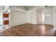 Open-concept living area with wood-look flooring, neutral walls, and natural light at 7140 Pascal Dr, Las Vegas, NV 89156