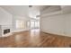Spacious living room features a fireplace, wood-look tile floors, and neutral paint at 7140 Pascal Dr, Las Vegas, NV 89156
