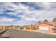 Street view showcasing the charming single-story home with desert landscaping and barrel tile roofs at 7140 Pascal Dr, Las Vegas, NV 89156