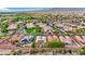 A tranquil neighborhood with well-kept lawns and mature trees in a lush landscaped area, close to mountain views at 7307 Lansbrook Ave, Las Vegas, NV 89131