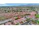 Panoramic aerial view of a neighborhood showcasing beautiful homes set against a desert backdrop, with open spaces at 7307 Lansbrook Ave, Las Vegas, NV 89131