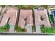 An aerial view shows homes in a well-manicured planned community with tile roofs and lush landscaping at 7307 Lansbrook Ave, Las Vegas, NV 89131