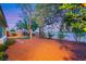 Spacious backyard with a small putting green and desert rock landscaping at 7307 Lansbrook Ave, Las Vegas, NV 89131