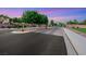 Gated entrance to the Silverlake community with stone pillars and lush landscaping at 7307 Lansbrook Ave, Las Vegas, NV 89131
