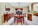 Formal dining room with a wooden table set, complemented by elegant decor and lighting at 7307 Lansbrook Ave, Las Vegas, NV 89131
