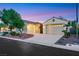 A charming single-story home showcasing a spacious driveway and a two-car garage at 7307 Lansbrook Ave, Las Vegas, NV 89131