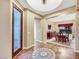 Inviting foyer with decorative tiled floors that flows into the dining room at 7307 Lansbrook Ave, Las Vegas, NV 89131