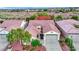 Charming single-story home with tile roof, desert landscaping, and attached two-car garage at 7307 Lansbrook Ave, Las Vegas, NV 89131