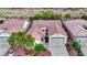Charming single-story home featuring a well-manicured yard and a two-car attached garage at 7307 Lansbrook Ave, Las Vegas, NV 89131