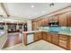 Bright kitchen features wood cabinets, stainless appliances, and open layout at 7307 Lansbrook Ave, Las Vegas, NV 89131
