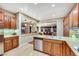 Modern kitchen with granite countertops, stainless steel appliances, and custom cabinetry at 7307 Lansbrook Ave, Las Vegas, NV 89131