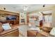 Spacious open-concept living room featuring hardwood floors and easy access to the modern kitchen at 7307 Lansbrook Ave, Las Vegas, NV 89131