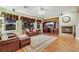 Comfortable living room features hardwood floors, a fireplace, and traditional furnishings at 7307 Lansbrook Ave, Las Vegas, NV 89131