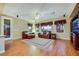 Bright living room showcasing a hardwood floor and a traditional seating arrangement at 7307 Lansbrook Ave, Las Vegas, NV 89131