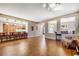 Open-concept living area showcases hardwood floors and bar seating to the kitchen at 7307 Lansbrook Ave, Las Vegas, NV 89131