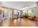 Spacious living room features hardwood floors, natural light, and neutral color palette at 7307 Lansbrook Ave, Las Vegas, NV 89131