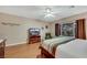 Cozy main bedroom featuring natural lighting, hardwood floors and a comfortable seating area at 7307 Lansbrook Ave, Las Vegas, NV 89131