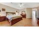 Large main bedroom boasting hardwood floors, dresser, and bright, natural lighting at 7307 Lansbrook Ave, Las Vegas, NV 89131