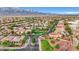 A scenic aerial view of a suburban neighborhood surrounded by picturesque mountains and desert landscape at 7307 Lansbrook Ave, Las Vegas, NV 89131