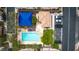 Overhead view of community pool, cabana, playground, and parking area surrounded by residences at 7559 Chimney Point Ct, Las Vegas, NV 89166