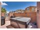 Private backyard with hot tub, barbecue, and brick fence providing a tranquil outdoor space at 7559 Chimney Point Ct, Las Vegas, NV 89166