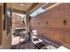 Private backyard featuring a hot tub, covered patio area, and brick privacy walls at 7559 Chimney Point Ct, Las Vegas, NV 89166