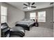 Bedroom with a ceiling fan, ample natural light, and neutral colors offer relaxation at 7559 Chimney Point Ct, Las Vegas, NV 89166