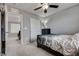 An open bedroom with plush carpeting, a closet, a dark dresser, and contemporary decor at 7559 Chimney Point Ct, Las Vegas, NV 89166