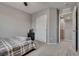 This bright bedroom boasts a double door closet and a cozy atmosphere with plush carpeting at 7559 Chimney Point Ct, Las Vegas, NV 89166