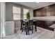 Eat-in kitchen with a table set, rug, and plenty of cabinet space for storage at 7559 Chimney Point Ct, Las Vegas, NV 89166