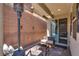 Relaxing covered patio with seating, heat lamp, and stylish decor for outdoor enjoyment at 7559 Chimney Point Ct, Las Vegas, NV 89166