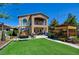 Spacious backyard featuring a lush lawn and comfortable outdoor seating, ideal for relaxation and recreation at 7609 Rory Ct, Las Vegas, NV 89129