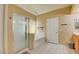 Bathroom featuring a glass shower, large tub, and tile flooring at 7609 Rory Ct, Las Vegas, NV 89129