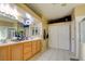 Bright bathroom featuring double sinks, tile floor, and a closet for ample storage at 7609 Rory Ct, Las Vegas, NV 89129
