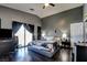 Spacious bedroom featuring dark hardwood floors and direct access to a private outdoor patio at 7609 Rory Ct, Las Vegas, NV 89129