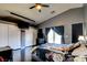Large bedroom with hardwood floors featuring access to a private outdoor patio and closet at 7609 Rory Ct, Las Vegas, NV 89129