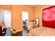 Bedroom with a bed, closet, mirror, and personal items, creating a lived-in feel at 7609 Rory Ct, Las Vegas, NV 89129