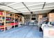 Organized garage with storage shelving, providing ample space for vehicles and storage at 7609 Rory Ct, Las Vegas, NV 89129
