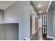 Upstairs hallway with wood floors and neutral paint and doors at 7609 Rory Ct, Las Vegas, NV 89129