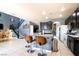 Stylish kitchen with island seating, stainless steel appliances, and an open flow to the dining area at 7609 Rory Ct, Las Vegas, NV 89129
