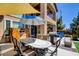 Inviting backyard patio with shaded seating and outdoor grill, creating an ideal space for entertaining at 7609 Rory Ct, Las Vegas, NV 89129