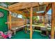 Custom wooden pergola with seating area, perfect for enjoying the outdoors in comfort and style at 7609 Rory Ct, Las Vegas, NV 89129